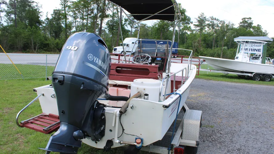 1982 Boston Whaler 17 Montauk center console boat with Yamaha 90hp outboard engine, showcasing rear view and trailer, available for sale at Cape Romain Marine.