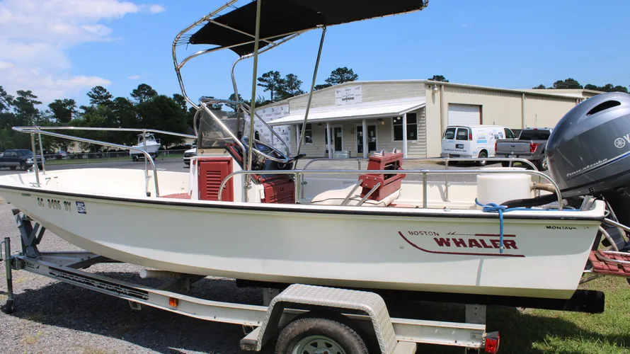 1982 Boston Whaler 17 Montauk center console boat on trailer, featuring Yamaha 90hp outboard engine, showcasing classic design and ready for sale at Cape Romain Marine.