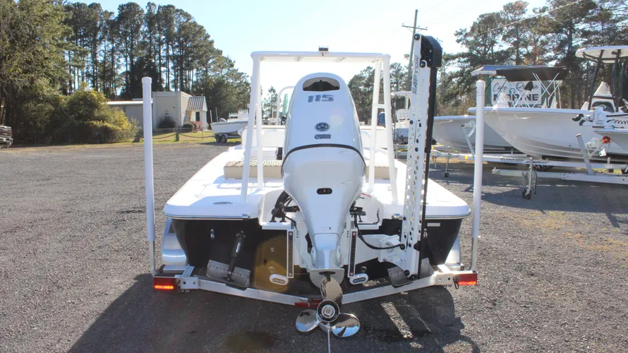2025 Action Craft 17 Flyfisher boat with Suzuki DF115 outboard engine, showcasing rear view in marine dealership setting, highlighting excellent condition and available for sale at Cape Romain Marine.