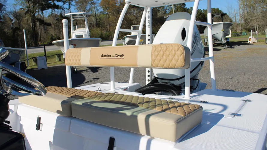 Action Craft boat seating with tan upholstery and logo, showcasing the interior features of the 2025 Action Craft 17 Flyfisher model.