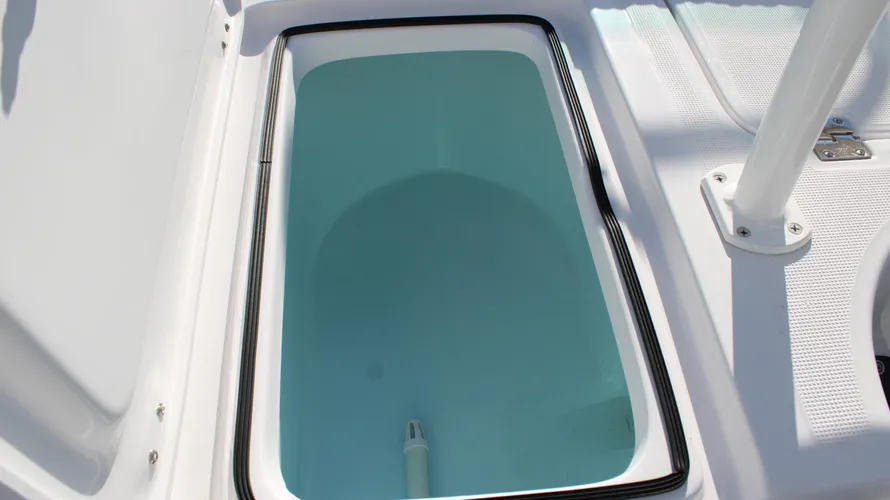 Livewell storage compartment in the 2025 Action Craft 17 Flyfisher, featuring a blue interior and sleek design, ideal for fishing enthusiasts.