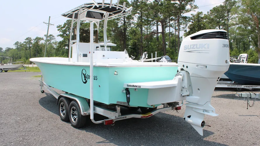 2025 C-Hawk 25 Center Console boat with Suzuki DF300APXW5 engine, turquoise hull, and trailer, designed for saltwater fishing, showcasing robust construction and capacity for 8 people.