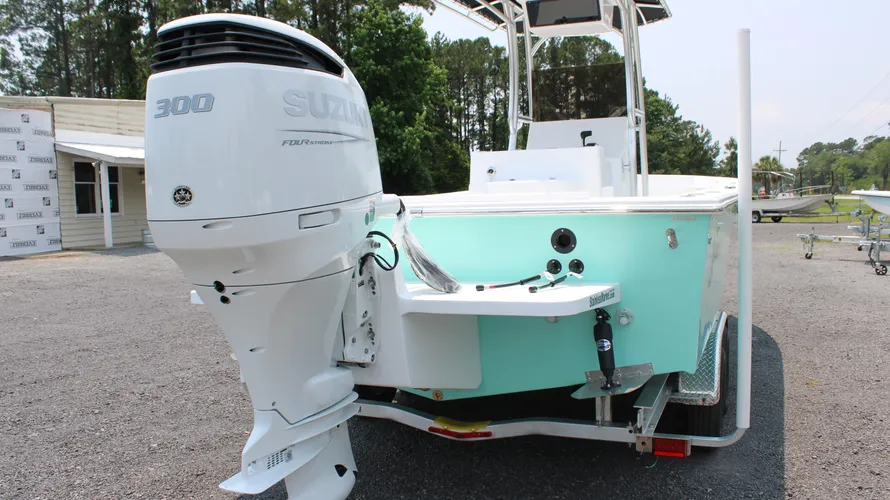 2025 C-Hawk 25 Center Console boat featuring a Suzuki DF300APXW5 engine, showcasing a sleek design and saltwater fishing capabilities, with a light blue color scheme and spacious seating arrangement.