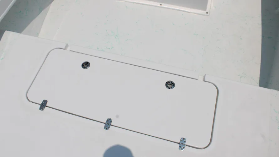 White deck hatch on a 2025 C-Hawk 25 Center Console boat, featuring stainless steel latches, designed for saltwater fishing.