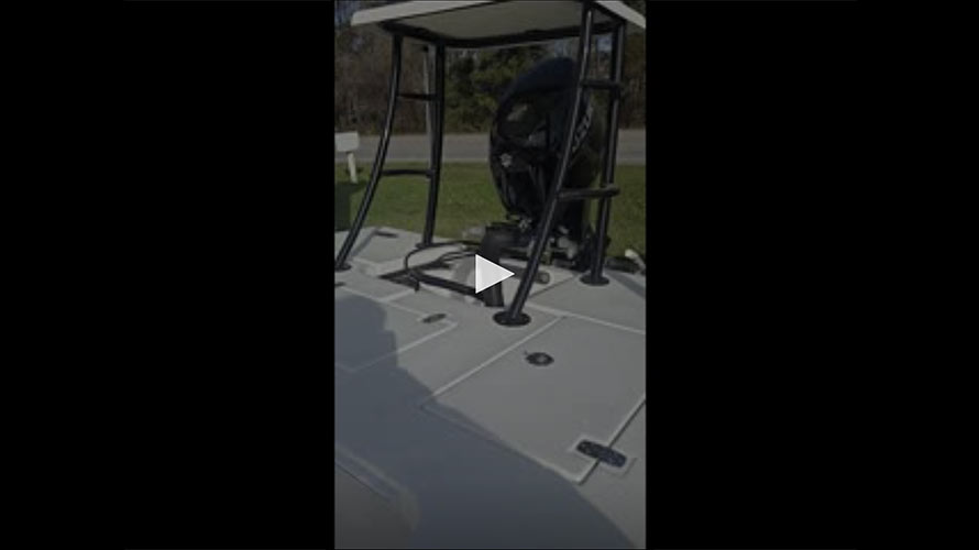 Mitzi Skiff 2025 17 Tournament interior showing control console, steering wheel, and engine mount, highlighting features for potential buyers at Cape Romain Marine.