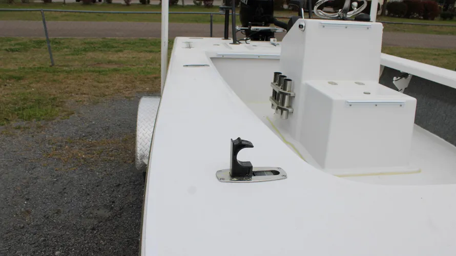 2025 Mitzi Skiff 17 Tournament interior view showcasing white deck, control console, and storage compartments, emphasizing features for fishing enthusiasts.