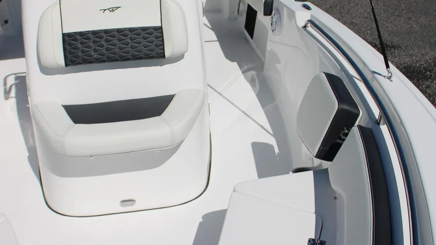 Interior view of the 2025 Tidewater Boats 198CC featuring sleek white seating and a modern design, highlighting comfort and style for boating adventures.