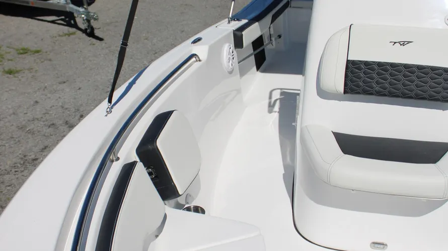 Interior view of the 2025 Tidewater Boats 198CC, showcasing the sleek white seating and modern design features, emphasizing comfort and style for boating enthusiasts.