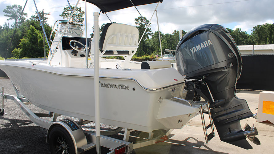 2025 Tidewater 198CC boat with Yamaha 150HP outboard motor, showcasing fiberglass hull, whisper grey color, and equipped with a comfortable seating area, parked at Cape Romain Marine.