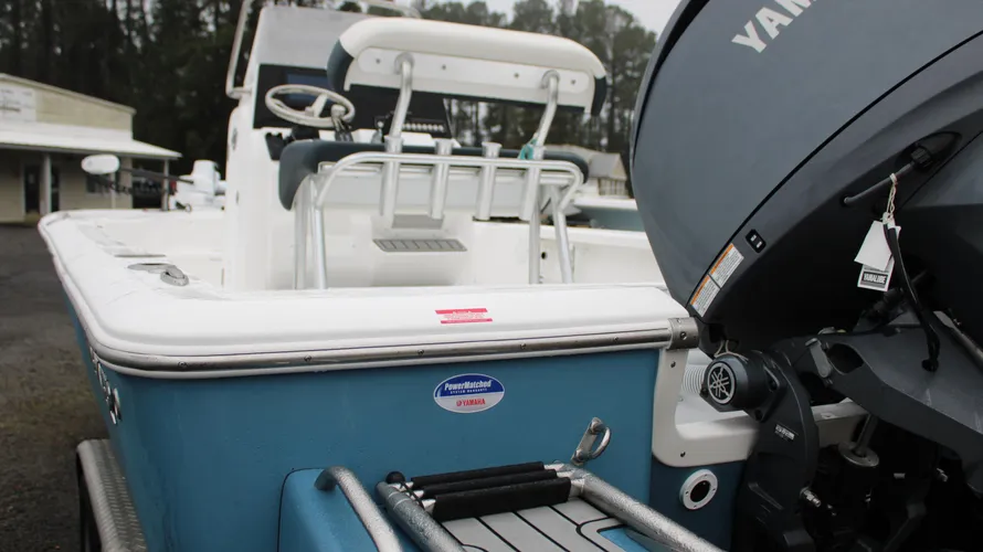2025 Tidewater Boats 2110 Bay Max in Blue Mist with Yamaha F150XC outboard engine, showcasing boat features and design elements in a marine setting.