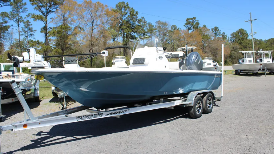 2025 Tidewater Boats 2110 Bay Max in Blue Mist color on trailer, showcasing outboard engine and fishing features, at Cape Romain Marine dealership.