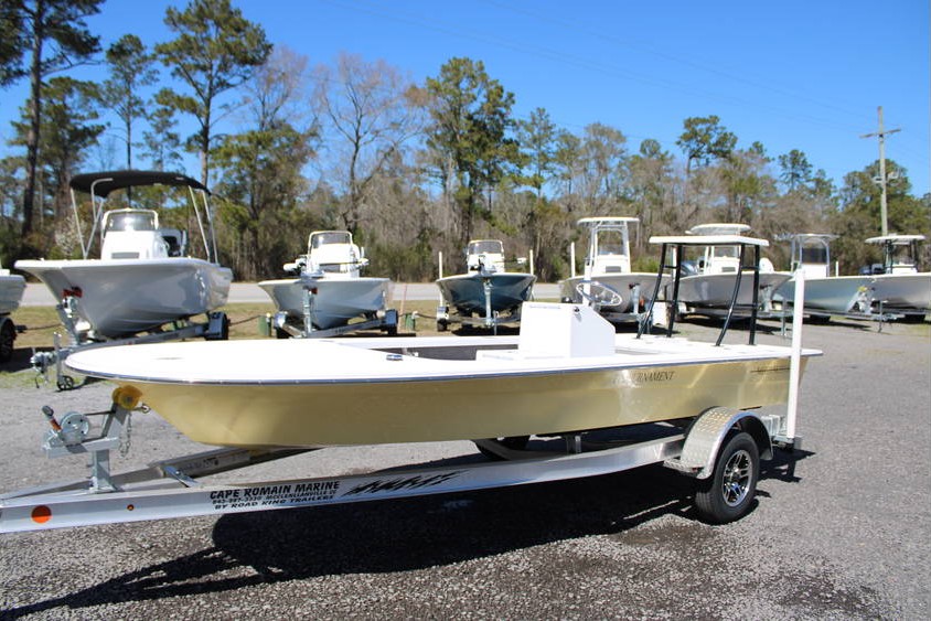Mitzi Skiff 2025 17 Tournament in Fighting Lady Yellow, showcasing a flat boat style on a trailer at Cape Romain Marine, with additional boats in the background.