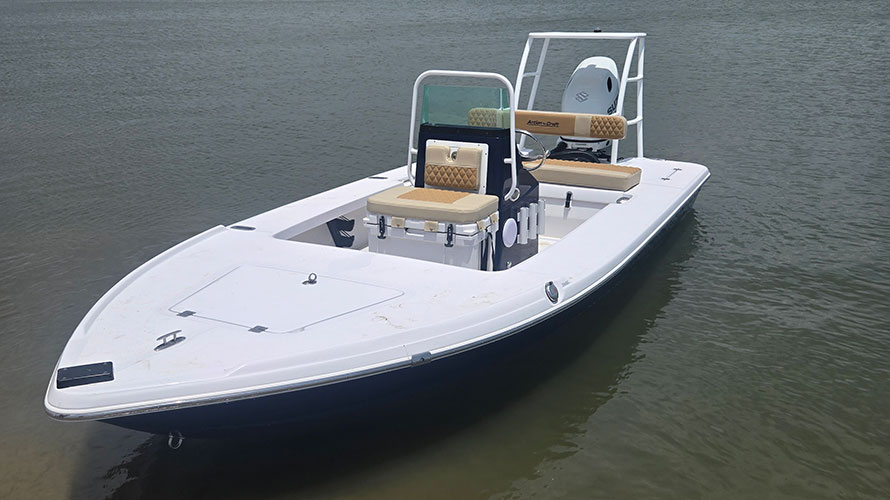 2025 Action Craft 17 Flyfisher boat in blue, featuring dual seating and a Suzuki outboard engine, positioned on calm water, showcasing its design and functionality for fishing.