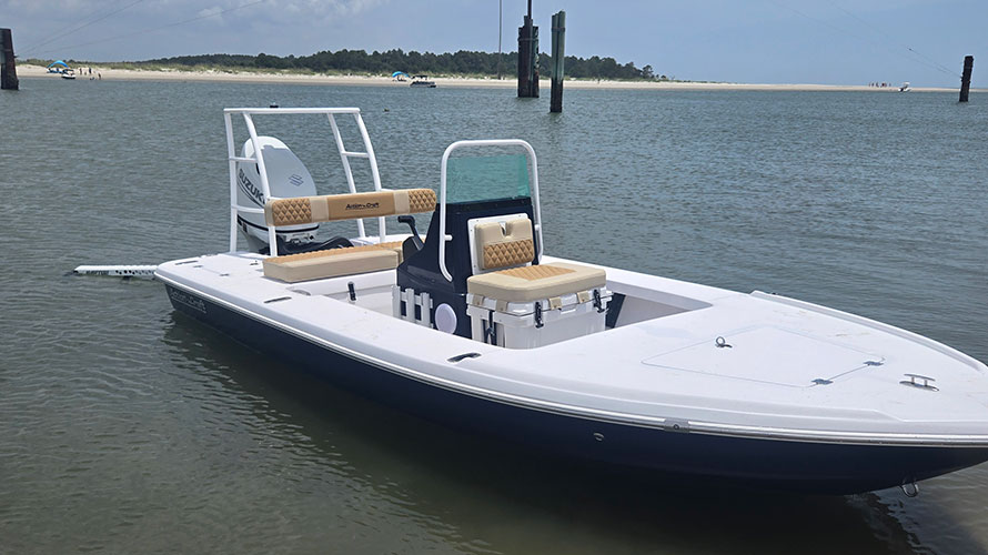 2025 Action Craft 17 Flyfisher boat in water, featuring a Suzuki outboard motor, dual seating, and a spacious deck, highlighting its excellent condition and suitability for fishing.