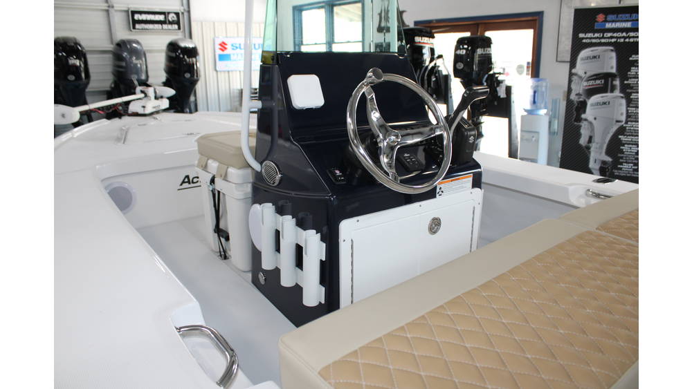 Interior view of the 2025 Action Craft 17 Flyfisher boat showcasing the helm with steering wheel, dashboard controls, and seating, highlighting its new condition and features for potential buyers at Cape Romain Marine.