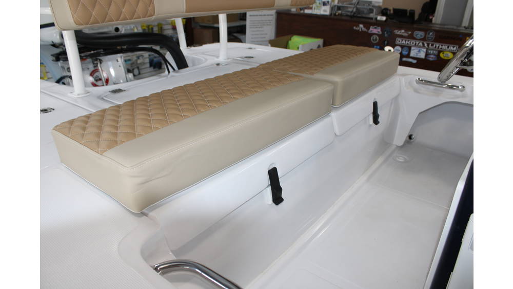 Interior seating of the 2025 Action Craft 17 Flyfisher boat featuring plush, quilted cushions in beige and a clean, white deck setting, highlighting premium design and comfort for boating enthusiasts.