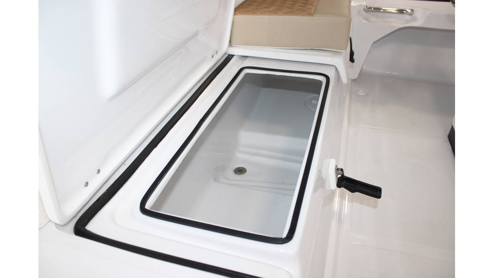 Interior view of the 2025 Action Craft 17 Flyfisher, showcasing a spacious storage compartment with a clear lid, designed for marine use, emphasizing functionality and storage options.
