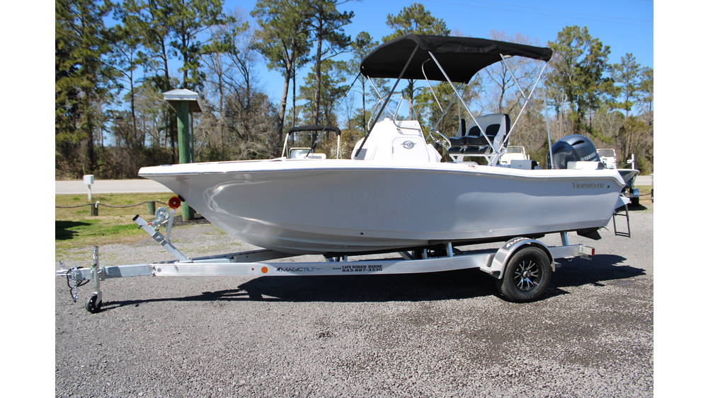 2025 Tidewater Boats 198CC in Whisper Grey on a bunk trailer, showcasing outboard Yamaha 150 engine, parked outdoors with trees in the background.