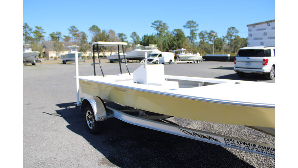 2025 17 Tournament Mitzi Skiff in Fighting Lady Yellow, showcasing sleek design and features, parked at Cape Romain Marine dealership.